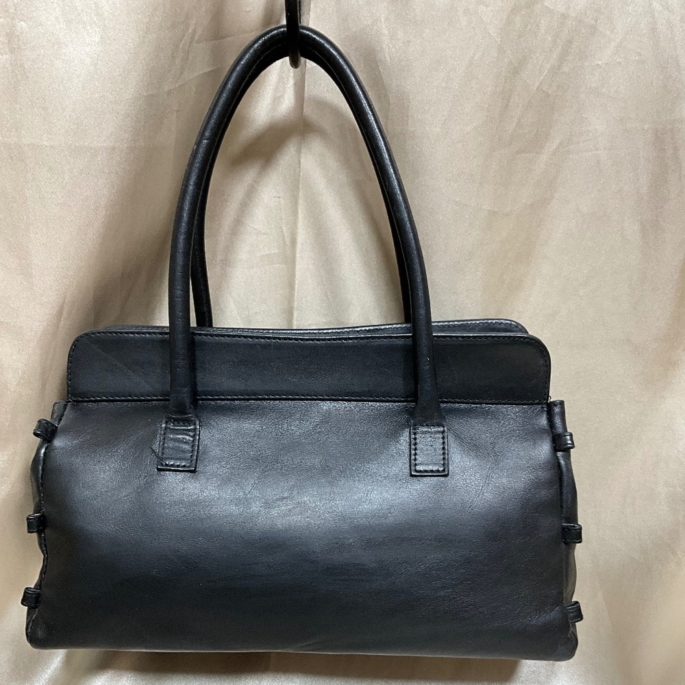 Vercace’ Jean Couture black leather and light weight.   49-H5Hb